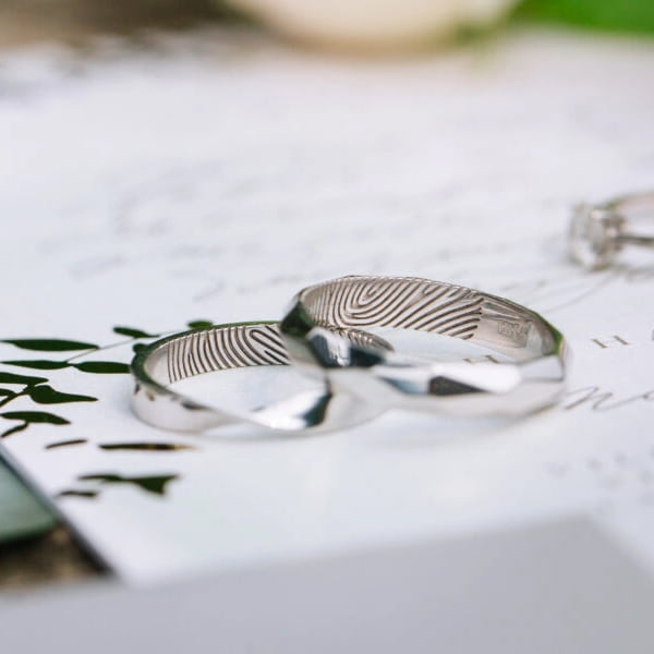 Personalised fingerprint design Fingerprint engraved wedding ring featuring unique partner's fingerprint pattern