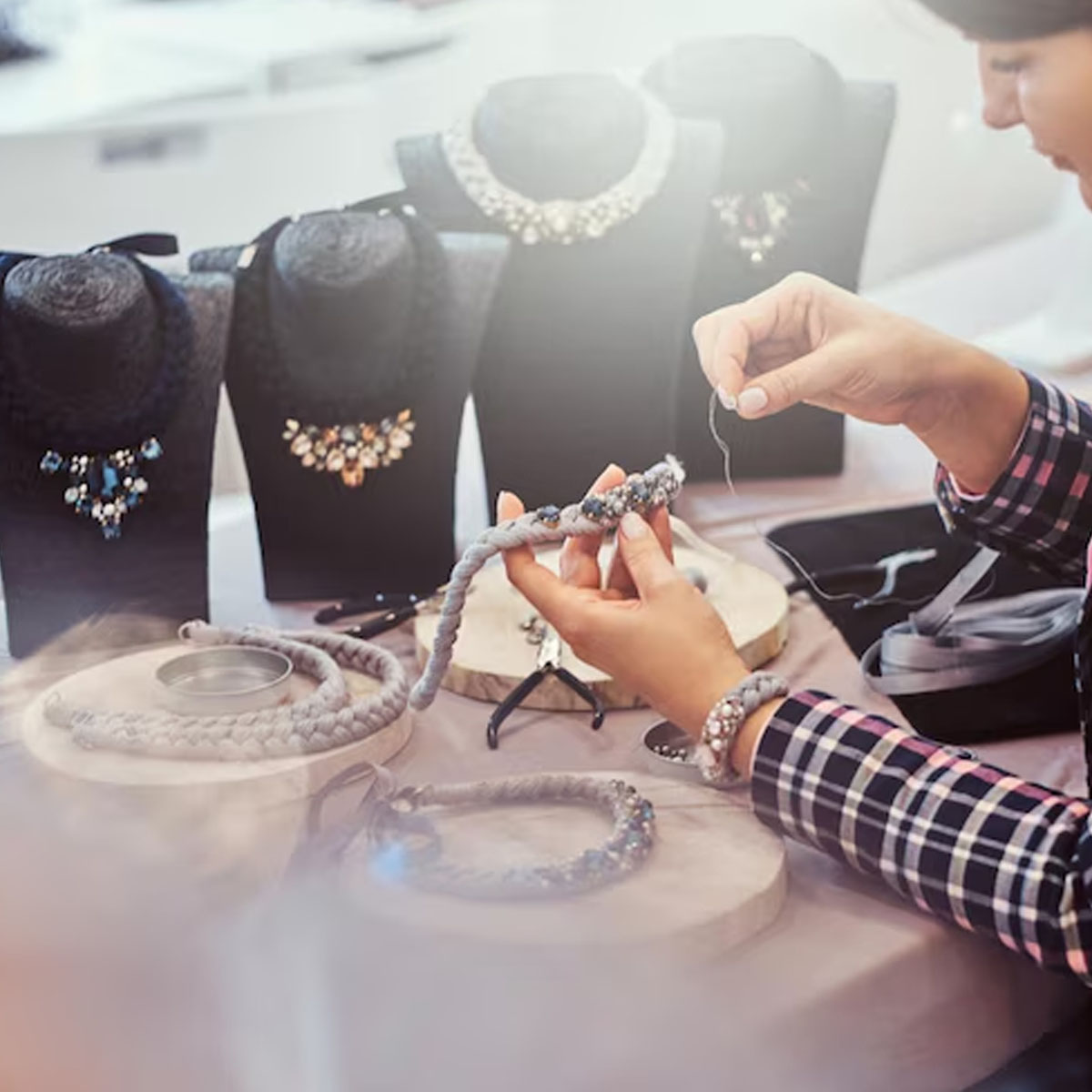Hands-on jewellery craftsmanship Jewellery student working at workbench during practical training session