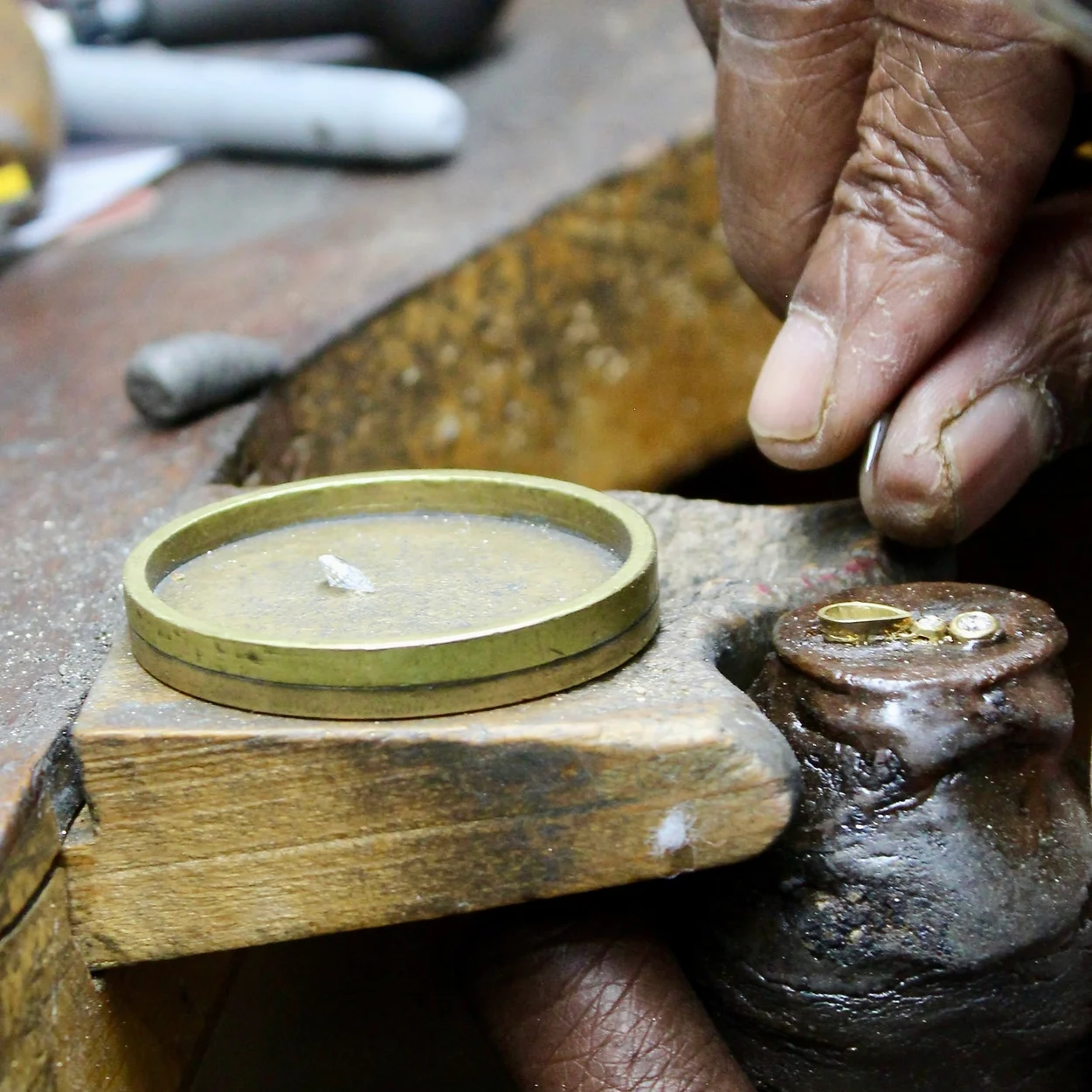 Goldsmith working at the bench at Barrett Jewellery, Hatton Wall, Hatton Garden