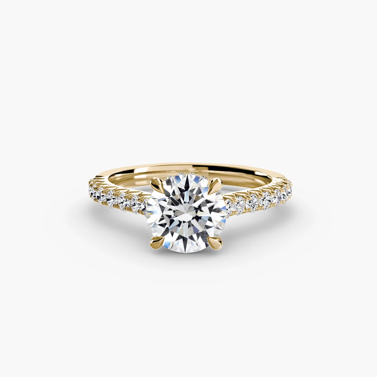 Round brilliant diamond solitaire ring with pave shoulders at JCO London, Hatton Garden